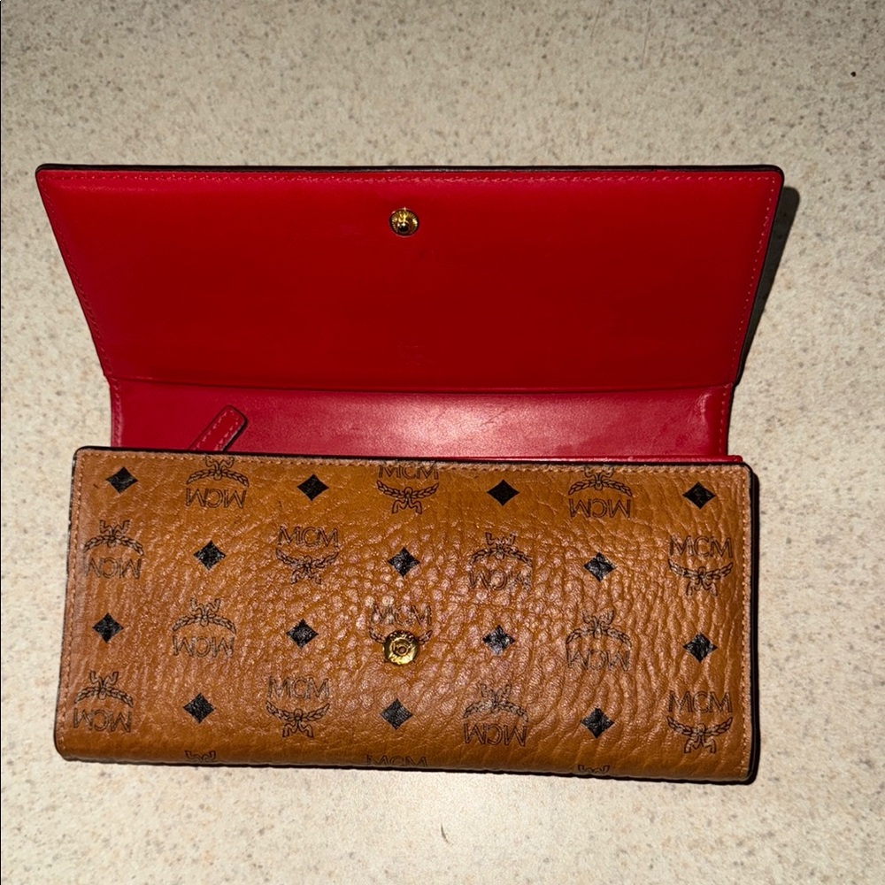 Authentic MCM Cognac Brown Monogram Wallet with Red Interior